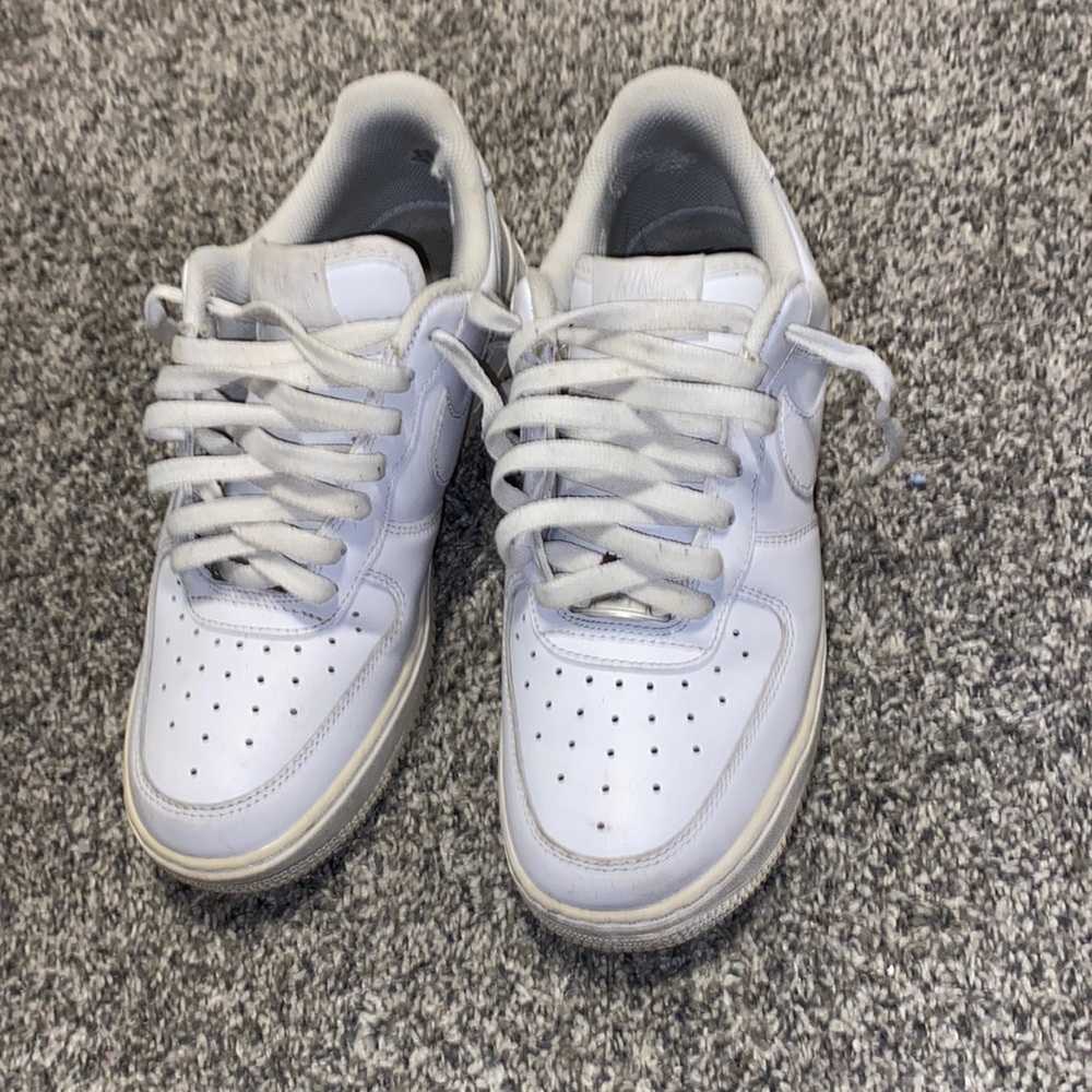 All white Air Force 1’s, Well worn